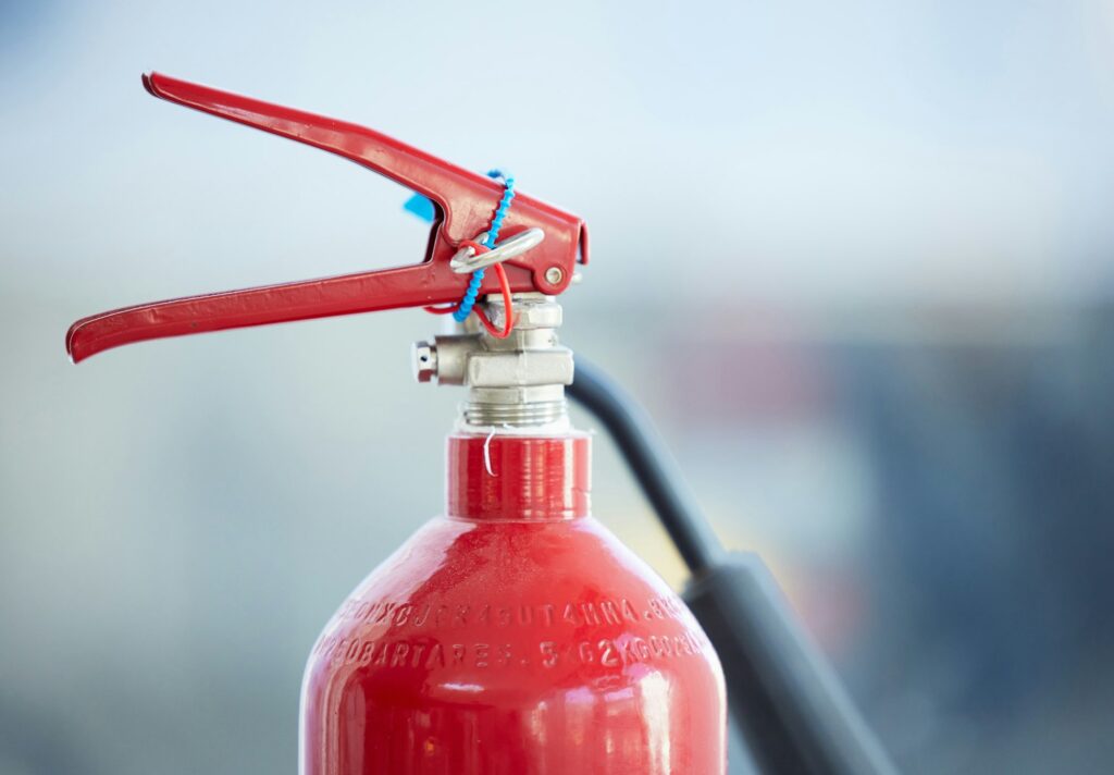 In case of fire, look for me. Shot of a red fire extinguisher.