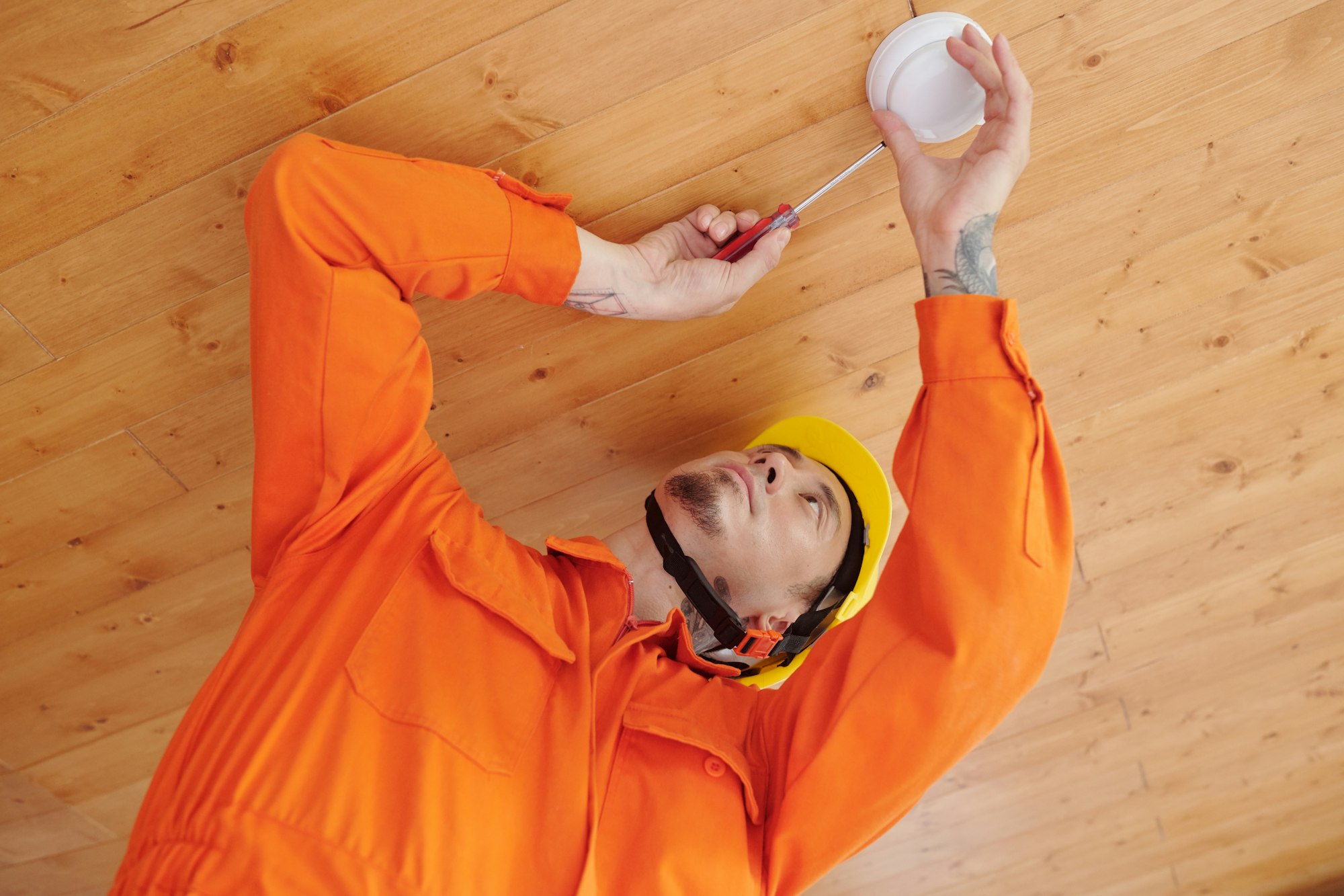Technician Installing Smoke Detector